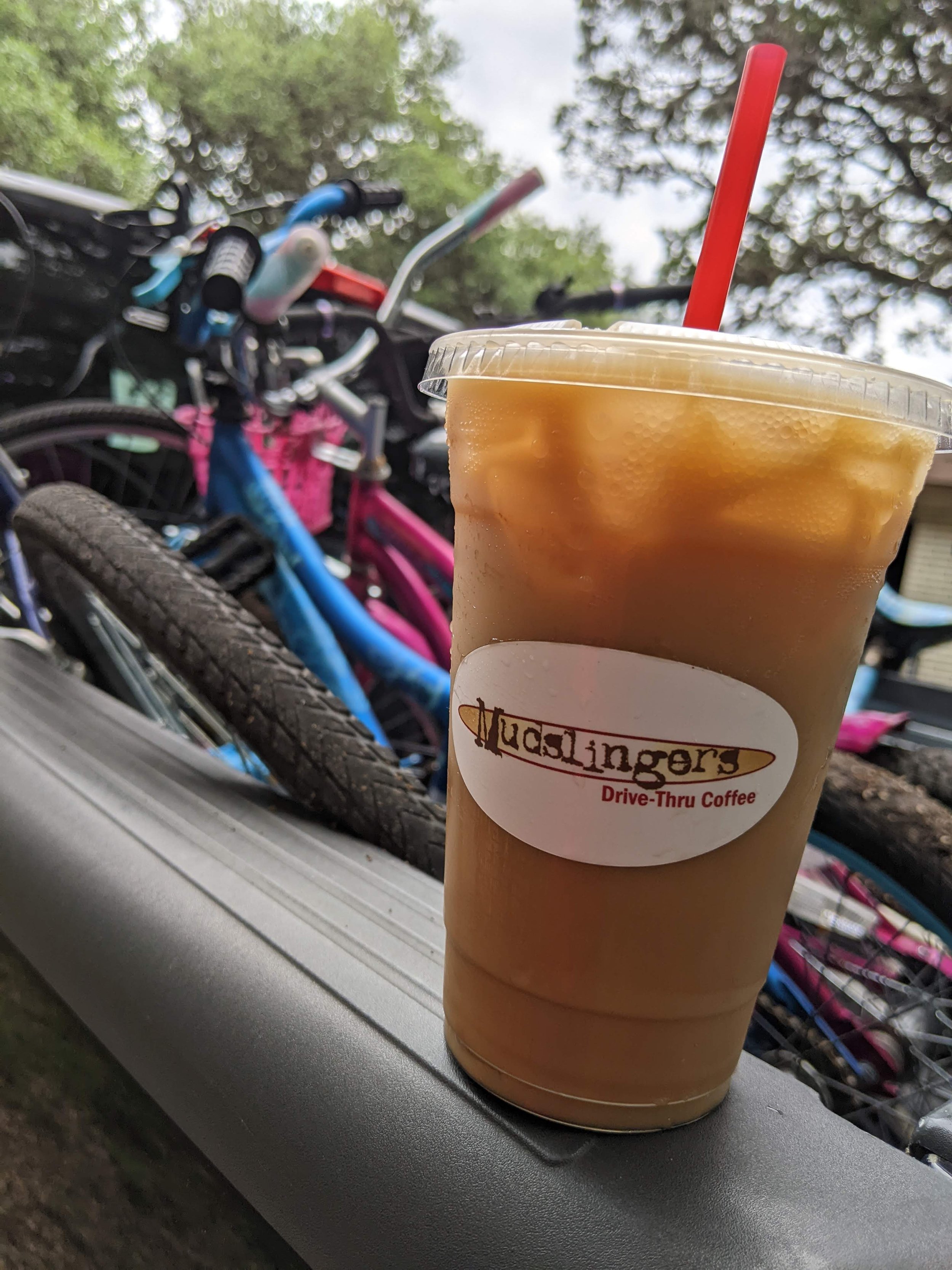 Mudslingers Iced Coffee in Front of bicycles